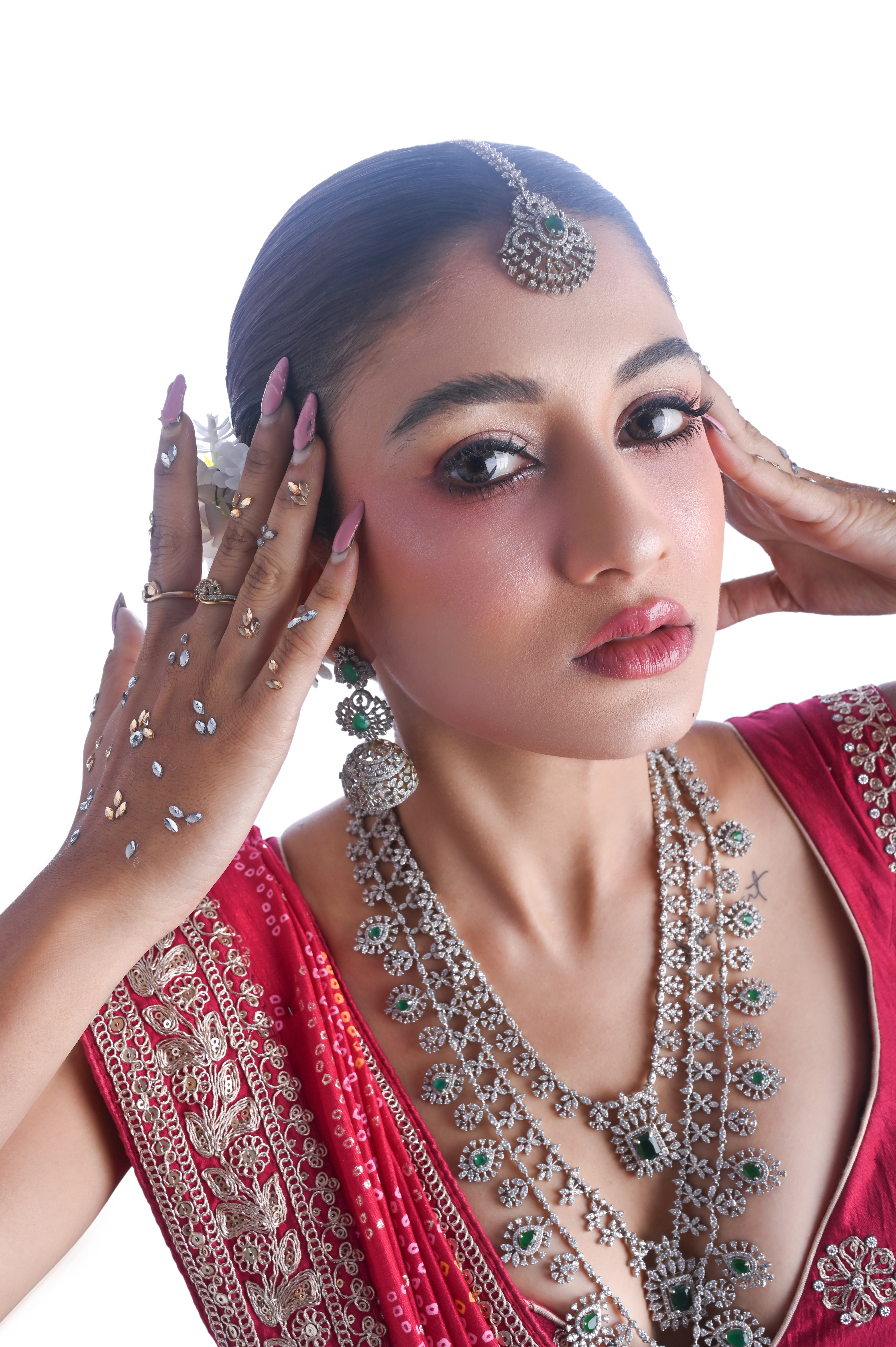 Close portrait studying skin, jewellery and red fabric