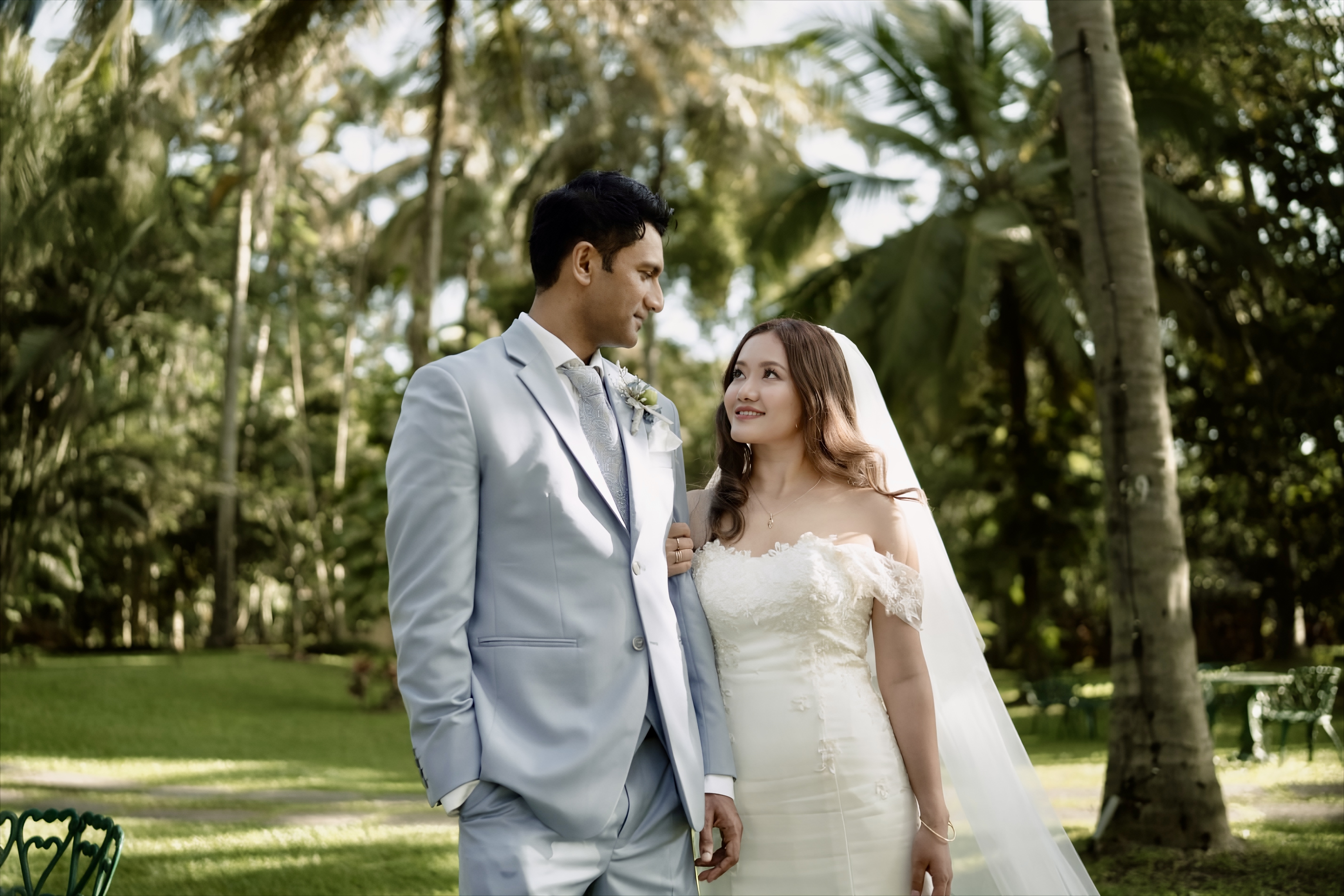 A bride surrounded by people during the ceremony morning