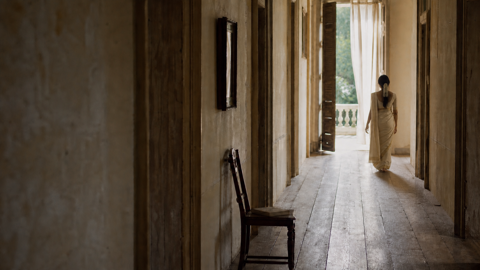 A bride seen quietly within a heritage interior in soft natural light.